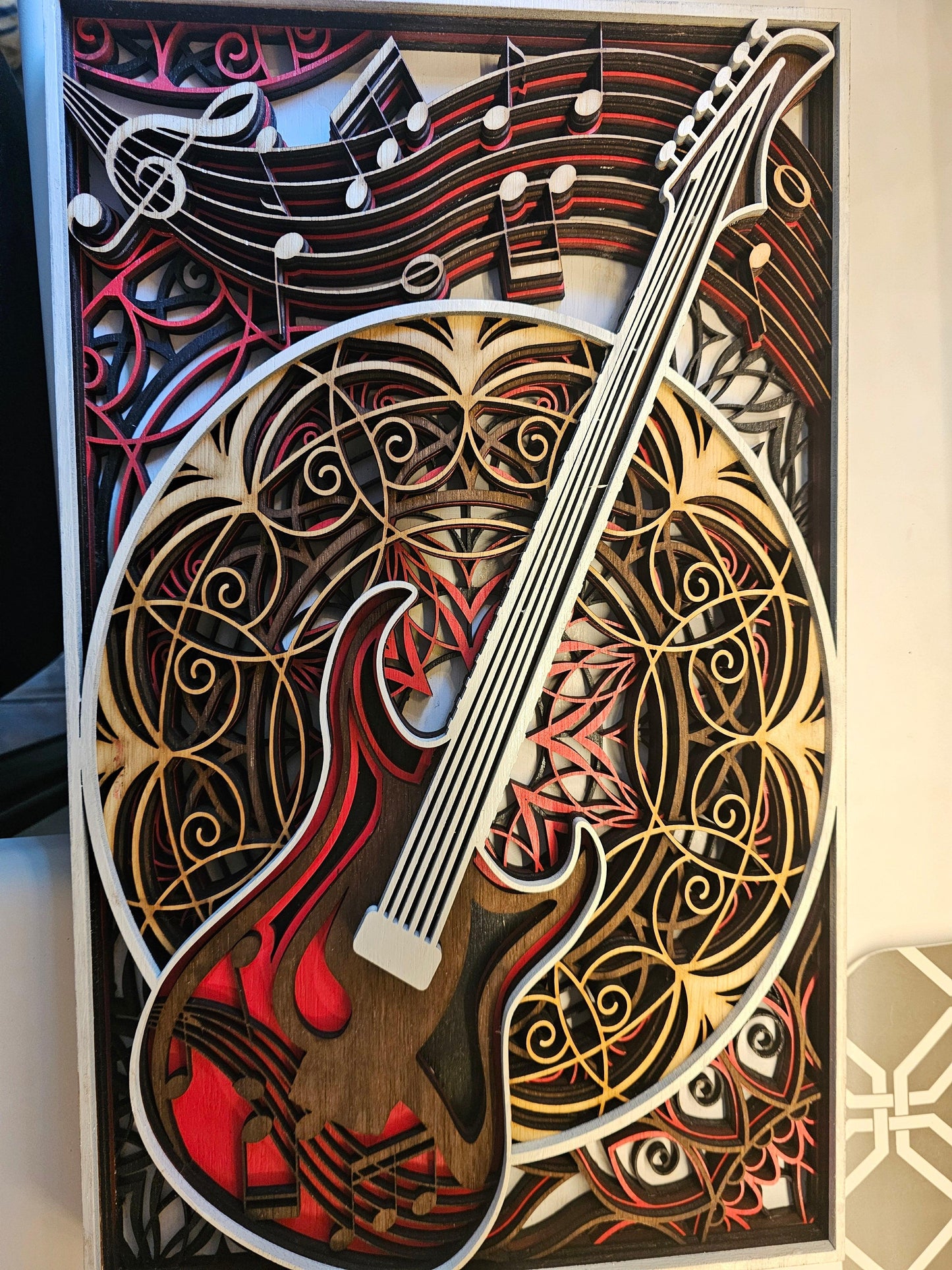 Layered wood art of electric guitar and music notes, custom fan art by BearNugget Customs