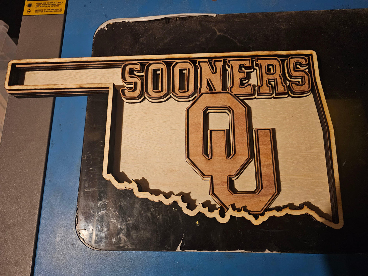 Custom wooden Oklahoma Sooners sign shaped like the state with OU logo, fan art by Bearnugget Customs