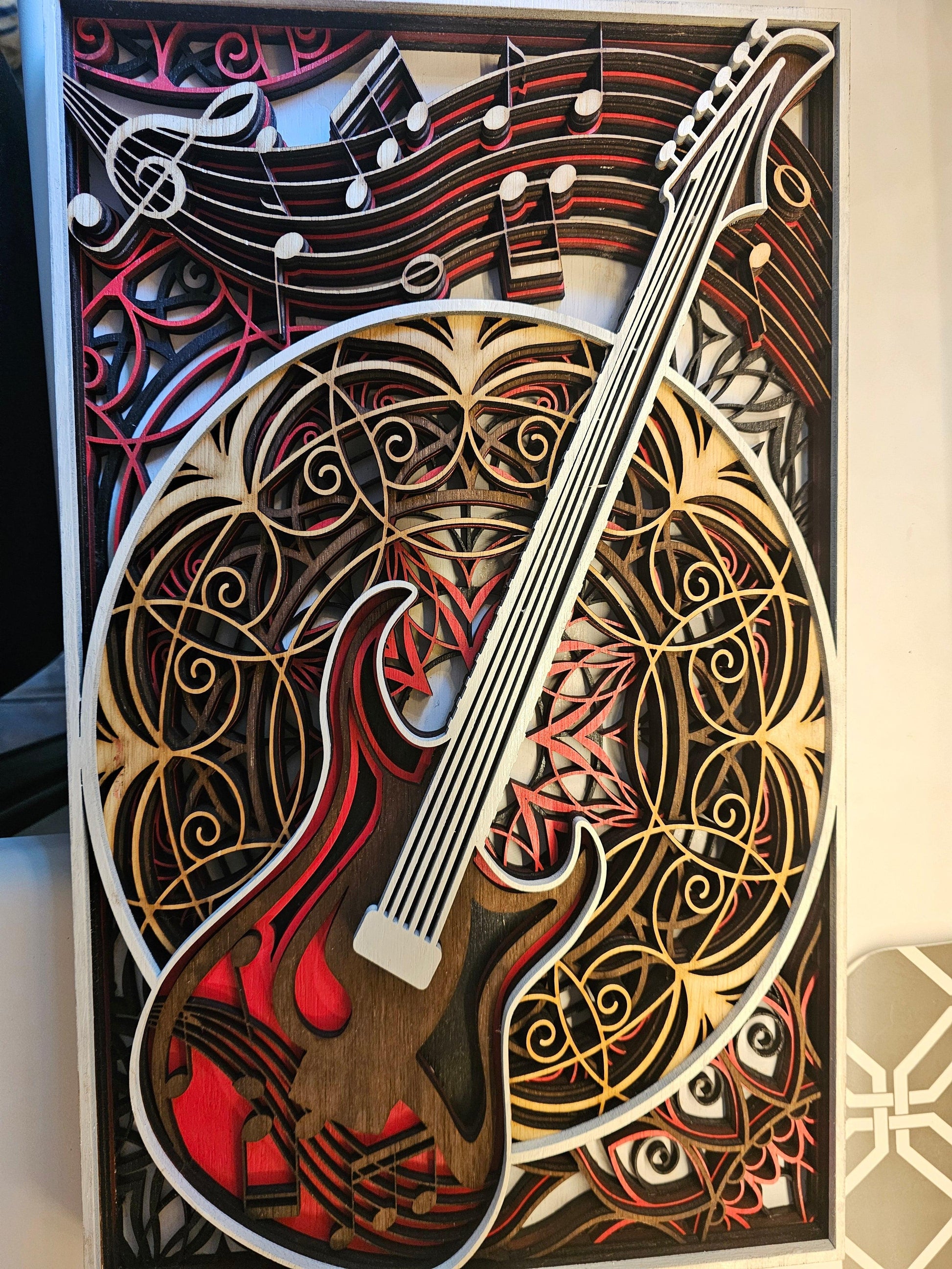 Layered wood art of electric guitar and music notes, custom fan art by BearNugget Customs
