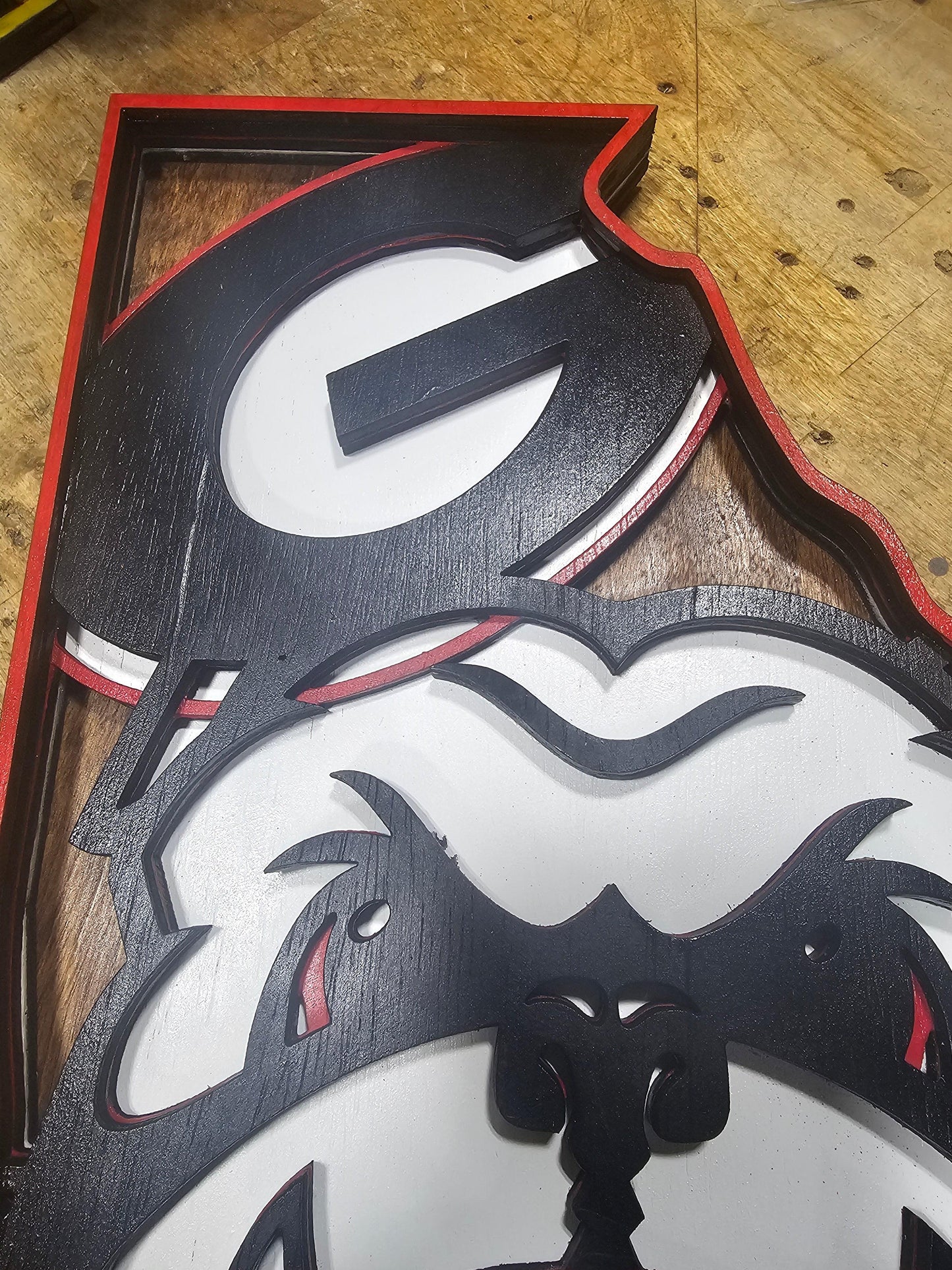 Custom wooden sports sign featuring a stylized bulldog and bold black letter G, handcrafted by Bearnugget Customs