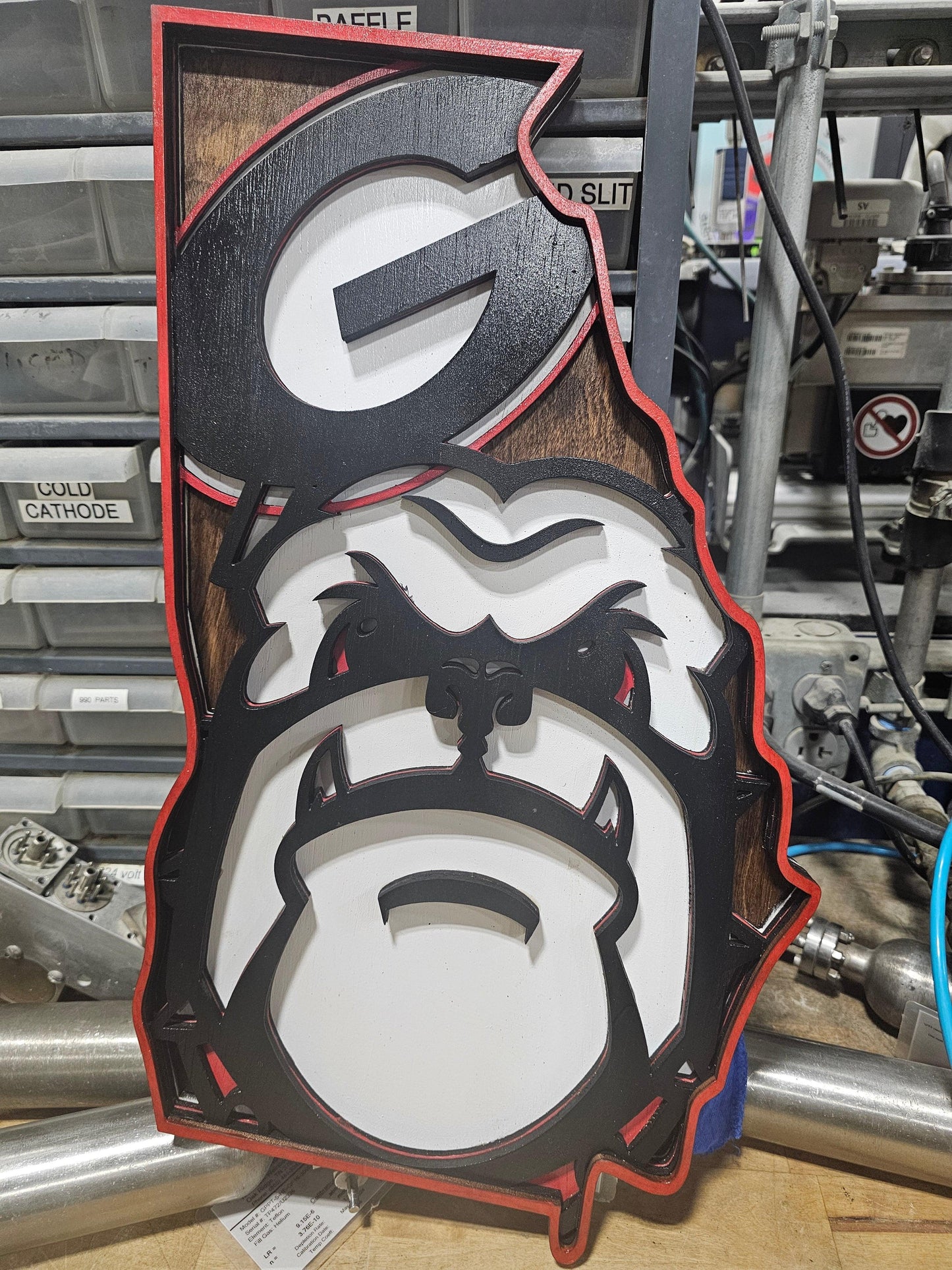 Custom Georgia state bulldog sports sign by Bearnugget Customs on workshop table
