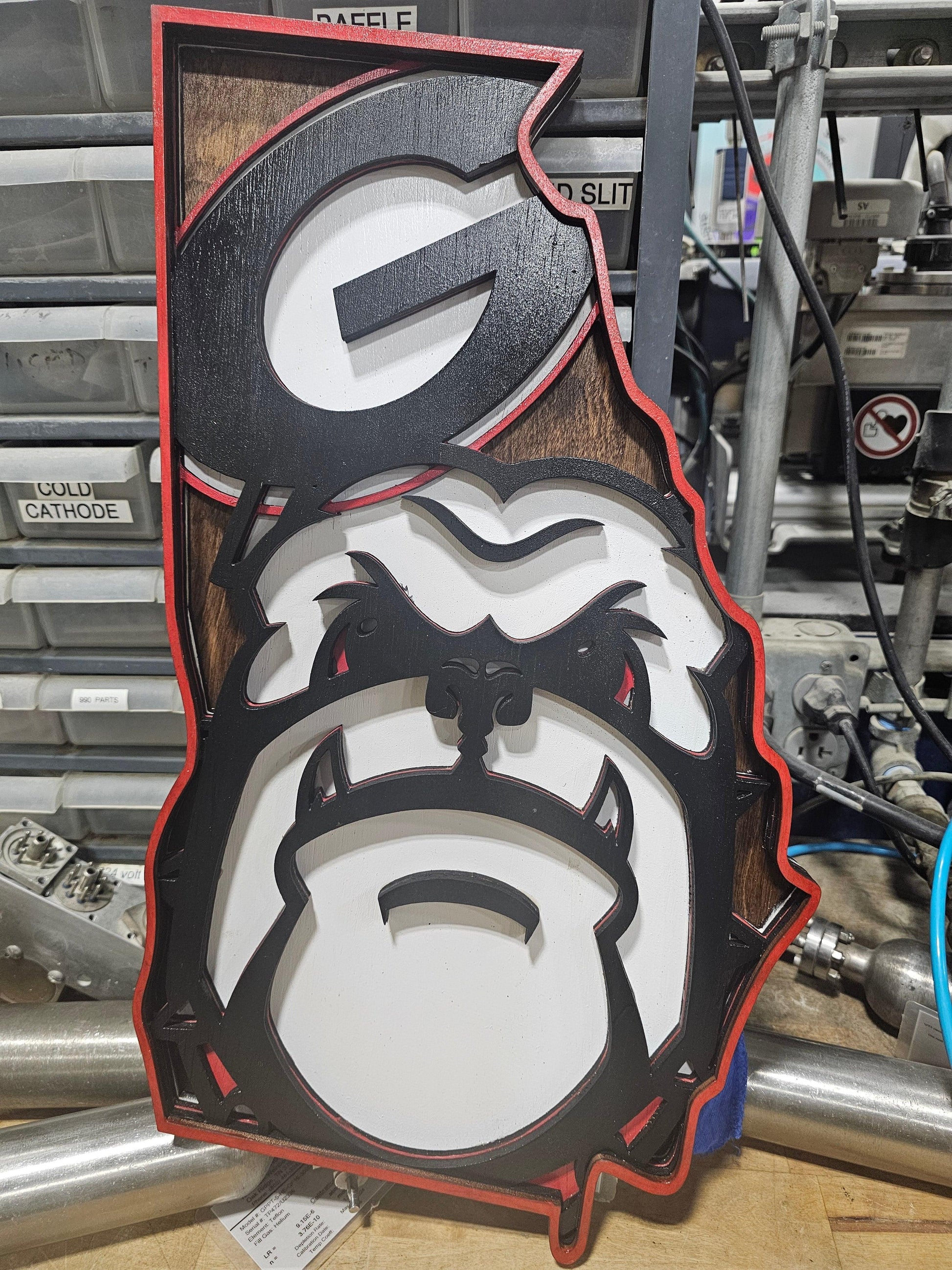 Custom Georgia state bulldog sports sign by Bearnugget Customs on workshop table