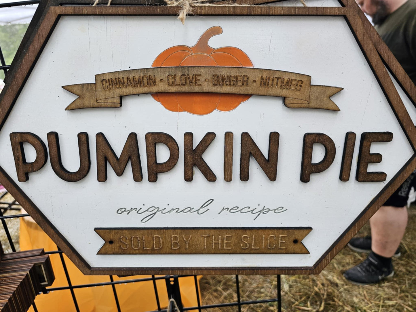 Wooden custom sign for pumpkin pie with orange pumpkin graphic, featuring ingredients and rustic font