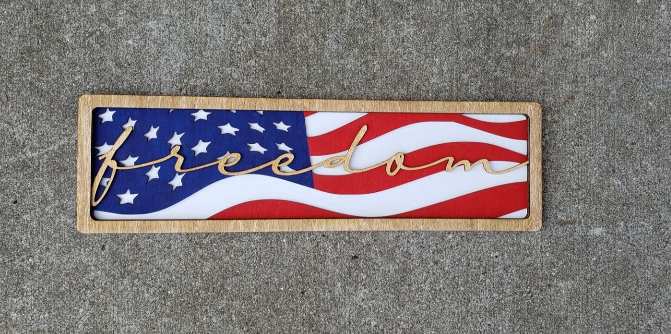 Patriotic wooden sign with American flag design and 'freedom' script by BearNugget Customs