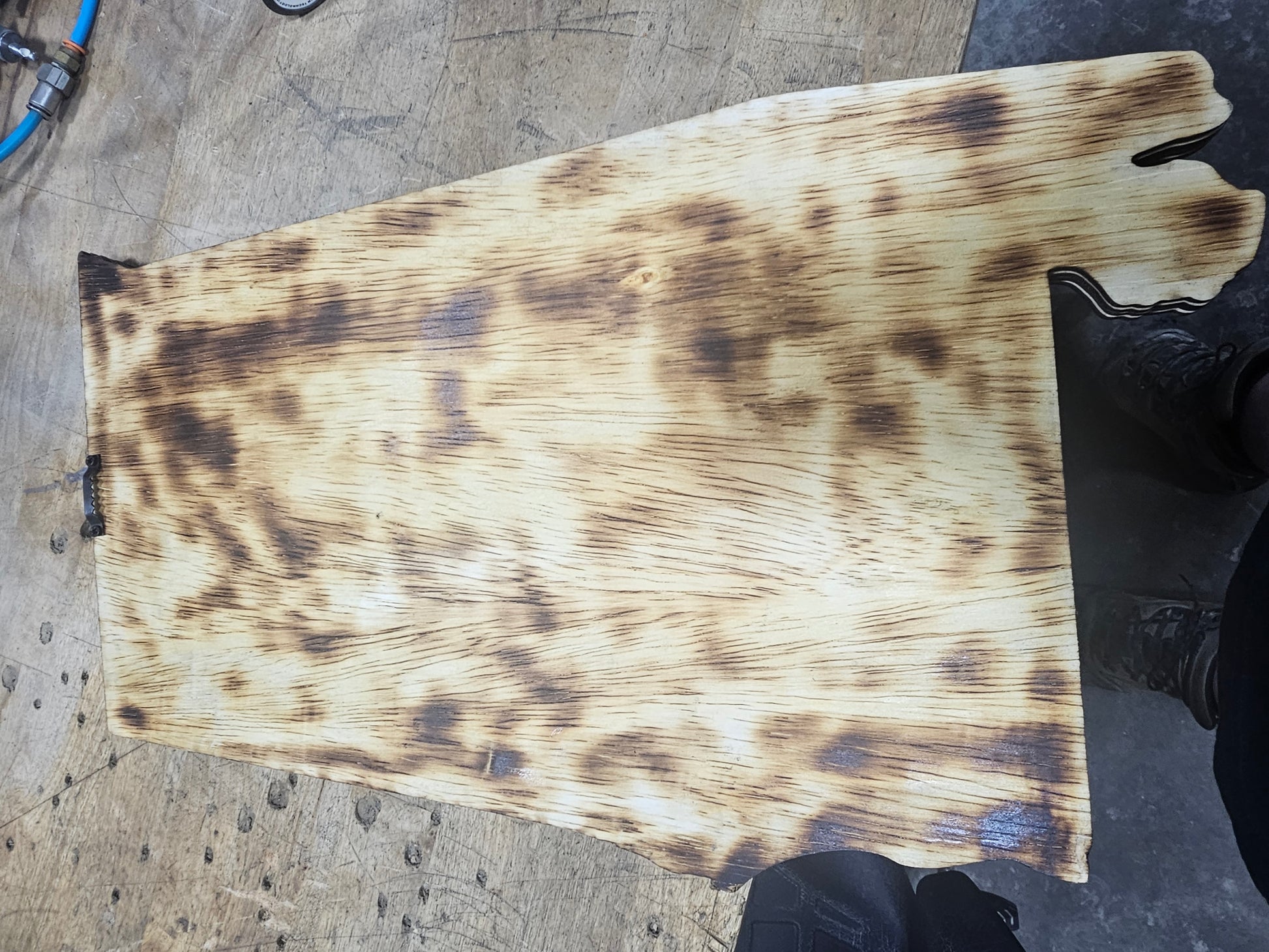 Burnt wood Alabama sign blank on workbench at BearNugget Customs for custom sports signs