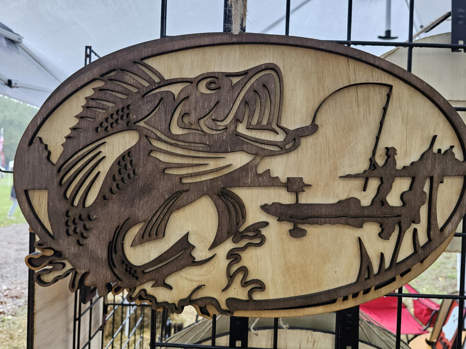 Wooden custom sign featuring a fish and fisherman silhouette, Bearnugget Customs fan art.