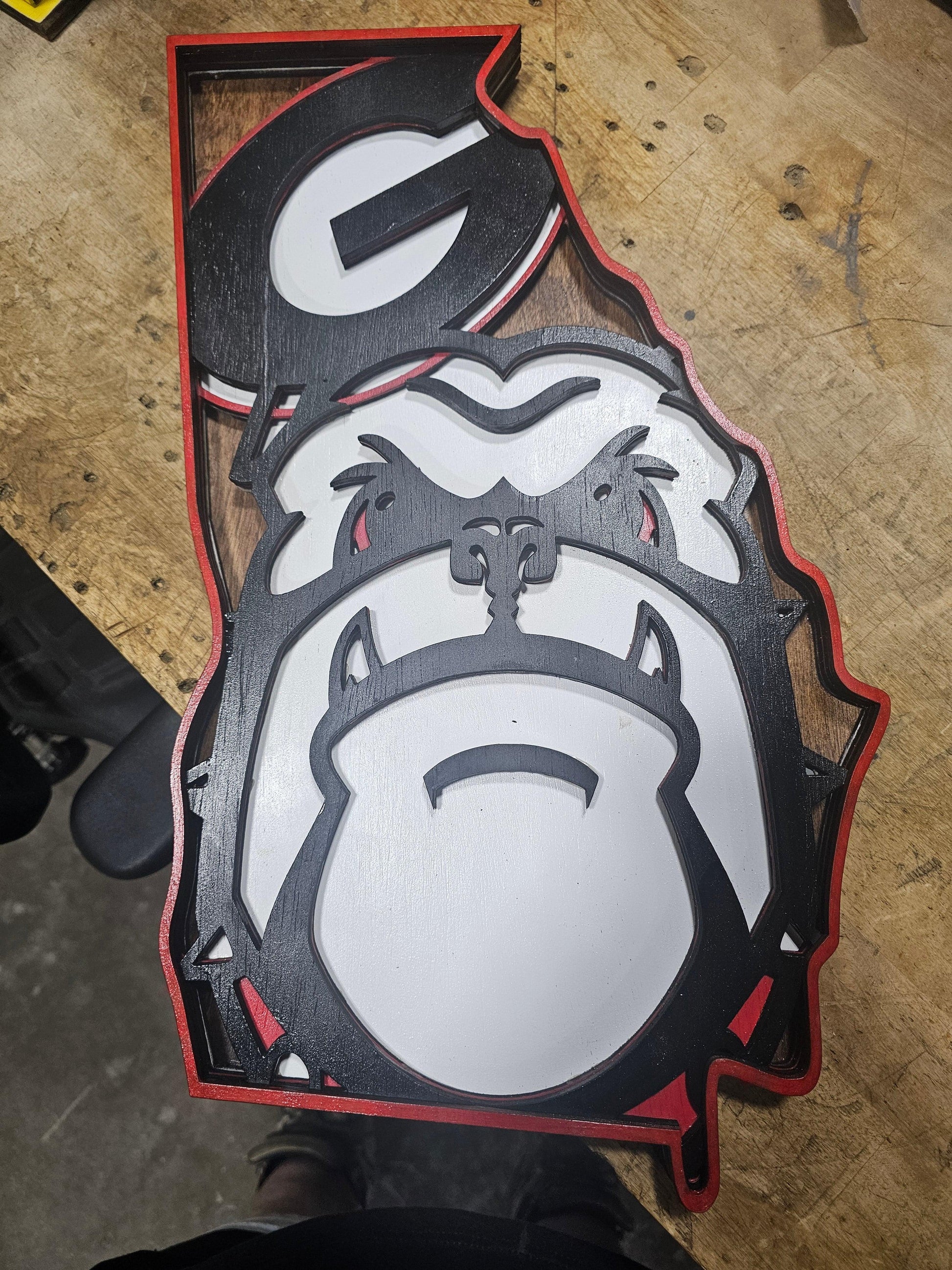 Custom Georgia Bulldogs wooden sign in state outline by BearNugget Customs on workbench